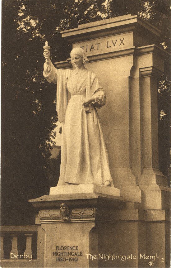 Statue of a White woman (Florence Nightingale) holding a lamp.