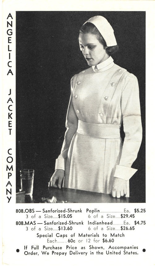 A White female nurse in white stands in front of a table looking to the left.