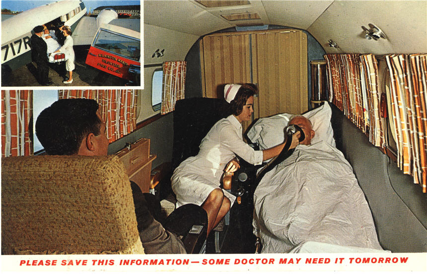 A White female nurse in white holds oxygen up to an elderly White male patient in an airplane.