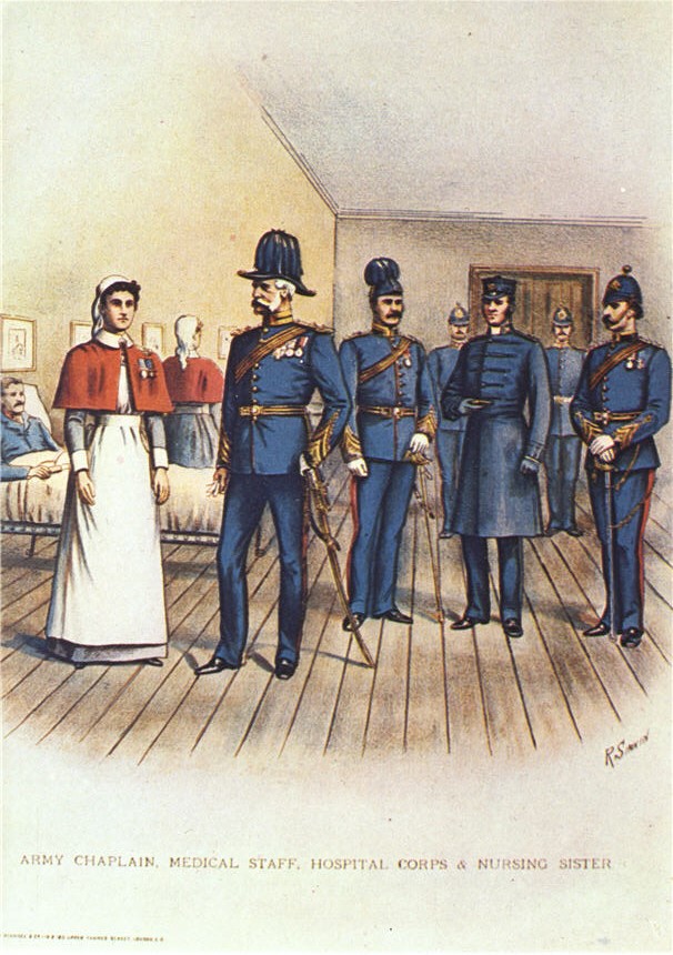 A White female nurse in white and red stands next to White male military officers in blue in a ward.