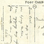 Back of postcard with two sections for handwriting, handwritten note and address appears.