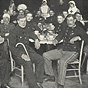 Twenty-three White male soldiers sitting in dining room with five White female Red Cross nurses.