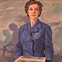 A White female nurse in blue holds out a package, with many hands reaching out towards the package.