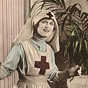 A White woman (Peggy Hyland) dressed as a nurse, looking to the right.
