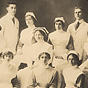 Group of eight White nurses and two White doctors sitting for group photograph.