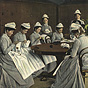 Ten White female nurses in gray sit around a table and sew.