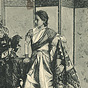 An Asian nurse in white knee length tunic, synched at waist, and wearing a sash.