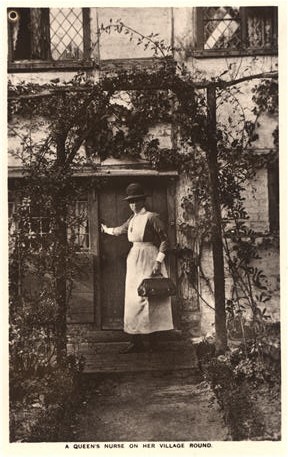 A White female nurse in white in front of a house with her hand on door, looking back at viewer.
