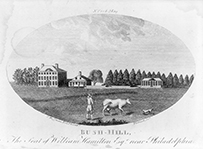 A bucolic scene of a man, a cow, and a dog in a large field in front of three buildings