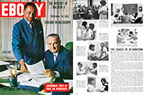 A cover of Ebony magazine with a photograph of a sitting white man and a standing black man