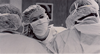 Dr. Lori Arviso Alvord, a female prepared for surgery wearing a cap, gown, and face mask.
