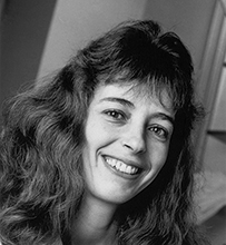 Dr. Karin Blakemore, a smiling female with medium length wavy hair in a collared jacket.