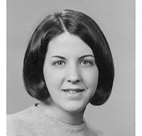 Dr. Rita Charon, a young White female with short cropped hair smiling for her portrait.