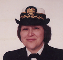 Dr. Sara K. Dye, an American Indian female posing in a decorated uniform and hat for her portrait.