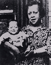 Dr. Justina Laurena Ford, an African American female holding an infant in her arms.