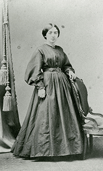 Dr. Mary Corinna Putnam Jacobi, a White female in a long dress posing for her portrait.