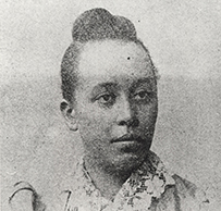 Dr. Halle Tanner Dillon Johnson, an African American female with her hair in a bun.