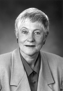 Dr. Olga Jonasson, a White female with short hair wearing a suit jacket.