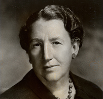 Dr. Julia M. Jones, an elderly White female in a turtleneck posing for her portrait.