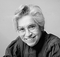 Dr. Joyce Cohen Lashof, a White female wearing glasses and a blouse posing with her arms folded for a portrait.