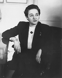 Dr. Alma Dea Morani, a female in a dark jacket seated.