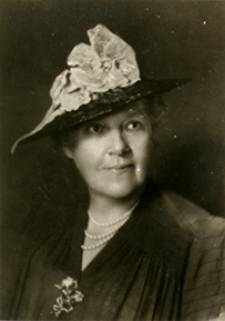 Dr. Rosalie Slaughter Morton, a female in a large hat with flowers posing for her portrait.