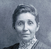 Dr. Susan La Flesche Picotte, a White female in a collared dress posing for her portrait.