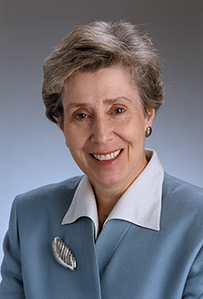 Dr. Deborah Elizabeth Powell, a White female in blue blouse smiling for her portrait.