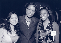 Dr. Joan Y. Reede, an African American female, center, posing with two females.
