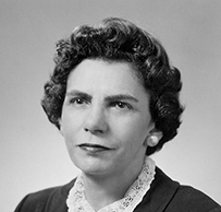 Dr. Charlotte Silverman, a White female in a lace blouse and jacket posing for her portrait.