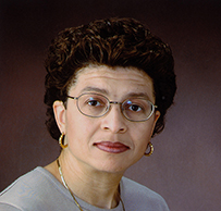 Dr. Jeannette E. Soth-Paul, an African American female with glasses and short hair posing for her portrait.