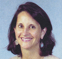 Dr. Sarah M. Stelzner, a White female with short dark hair posing for her portrait.