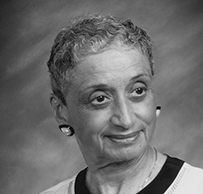 Dr. Natalia M Tanner, an African American female in professional attire posing for her portrait.