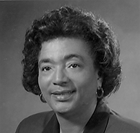 Dr. Yvonnecris Smith Veal, an African American female with short hair in professional attire posing for her portrait.