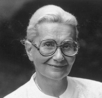 Dr. Lila Amdurska Wallis, an elderly White female wearing glasses posing for her portrait.