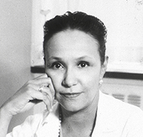 Dr. Jane Cooke Wright, an African American female in a lab coat and pearls resting her hand on her cheek for her portrait.