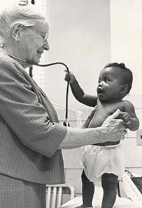 Dr. Margaret Irving Handy, an elderly White female with an African American toddler who is tugging on the stethoscope around her neck. 