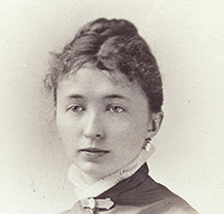 Dr. Helen Cordelia Putnam, a White female in a ruffled collar posing for her portrait.