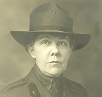 Dr. Loy McAfee, a White female in uniform and a hat posing for her portrait.

