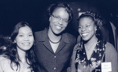 Dr. Joan Y. Reede, an African American female, center, posing with two females