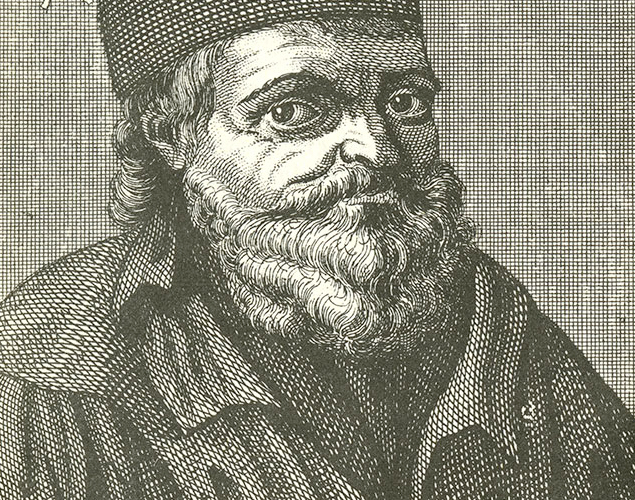 Portrait of a man with a beard in a cap.