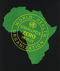A green map of Africa with a yellow stamp on top that says World Health Organization. Smallpox Zero 26.10.79 in yellow lettering.