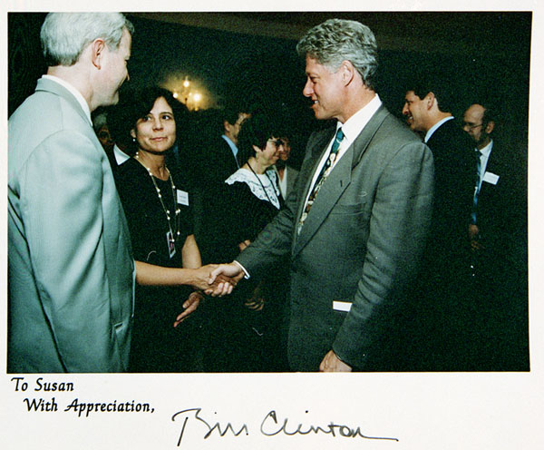 Color photograph of Susan Lederer shaking President Bill Clinton's hand. At the bottom is written To Susan with appreciation and it is signed Bill Clinton.