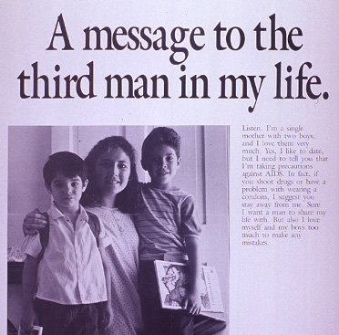 A woman stands with two boys