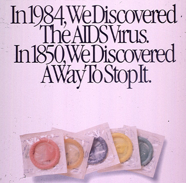 Color photograph of 5 condoms underneath text, on a pink-purple background