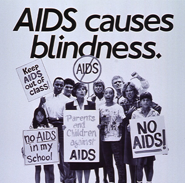 Black and white image of multiracial group of people holding various anti-AIDS signs