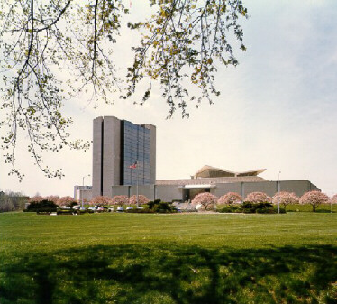 View of the front of NLM with trees in bloom
