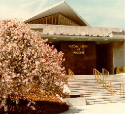View of the front entrance of NLM with trees in bloom