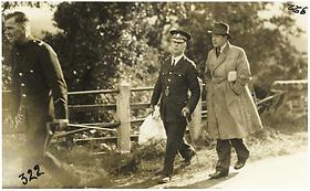 Policeman with a bag of human remains, 1935