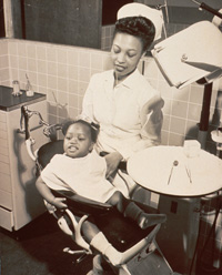 Dental nurse with baby girl IHM #A029580